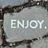 Treffpunkt, Kraftplatz und Hotel in Hornbach Stein mit dem Wort ENJOY auf Kopfsteinpflaster